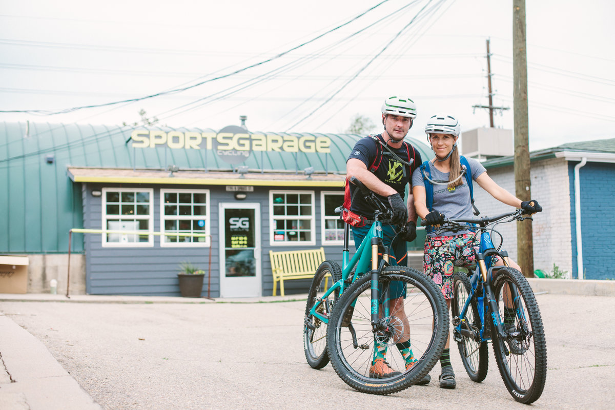 Owners Brad and Elorie outside the Sports Garage store