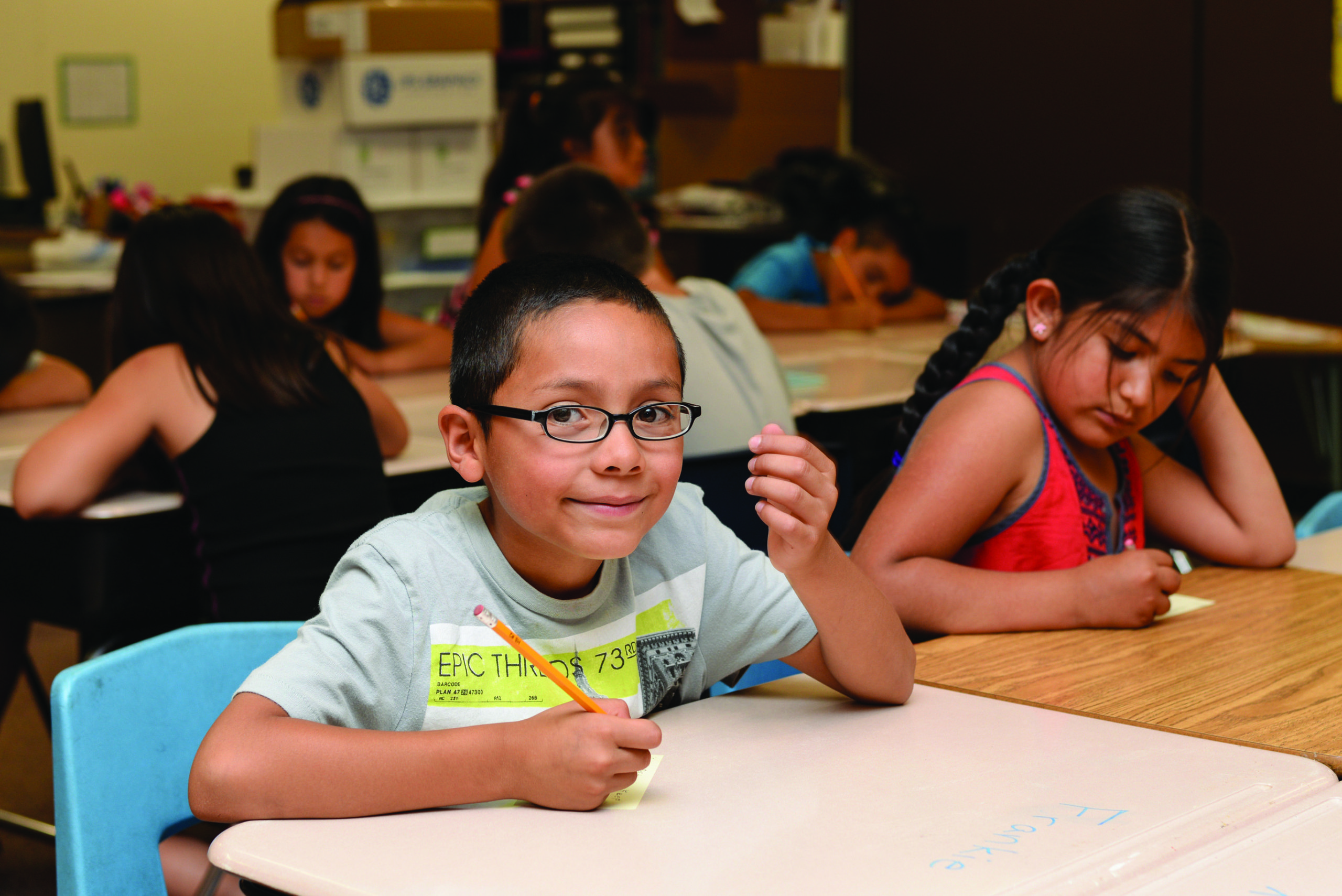 Elementary students practicing writing