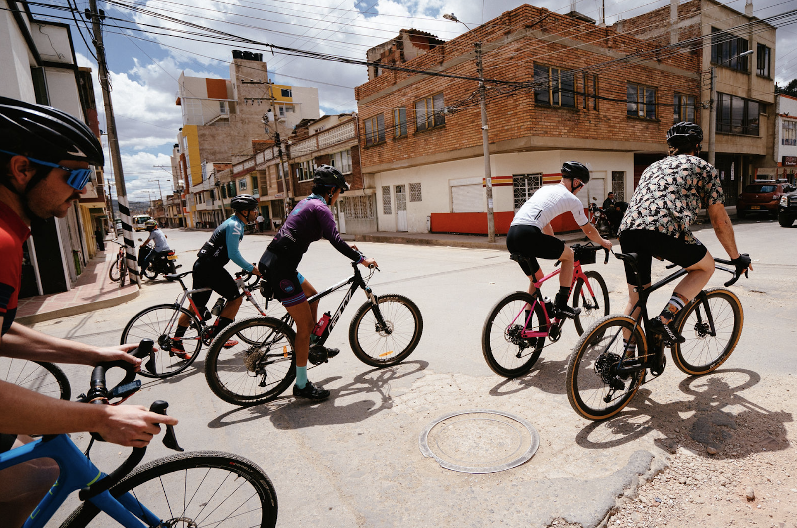 Group of cyclists riding through Duitama