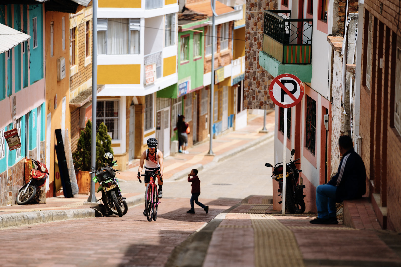 Cyclist riding through Colombia city streets